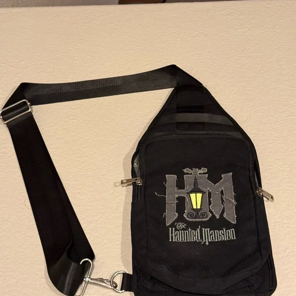 Disney Black Haunted Mansion Sling Backpack with Yellow Lantern - Picture 2 of 5